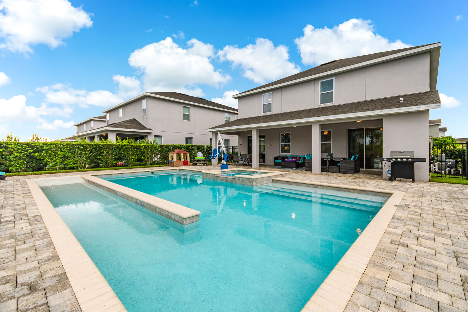 Gradual walk-in beach entry sloping into the pool