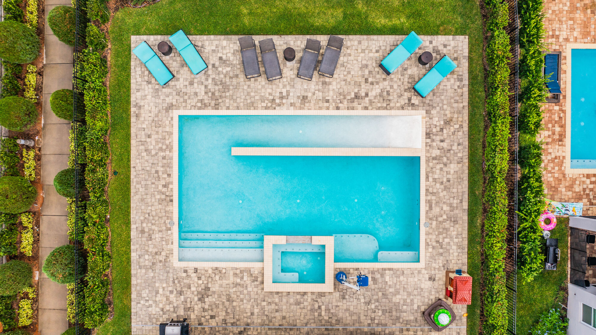 Overhead view of the private heated pool, spa and extended deck area