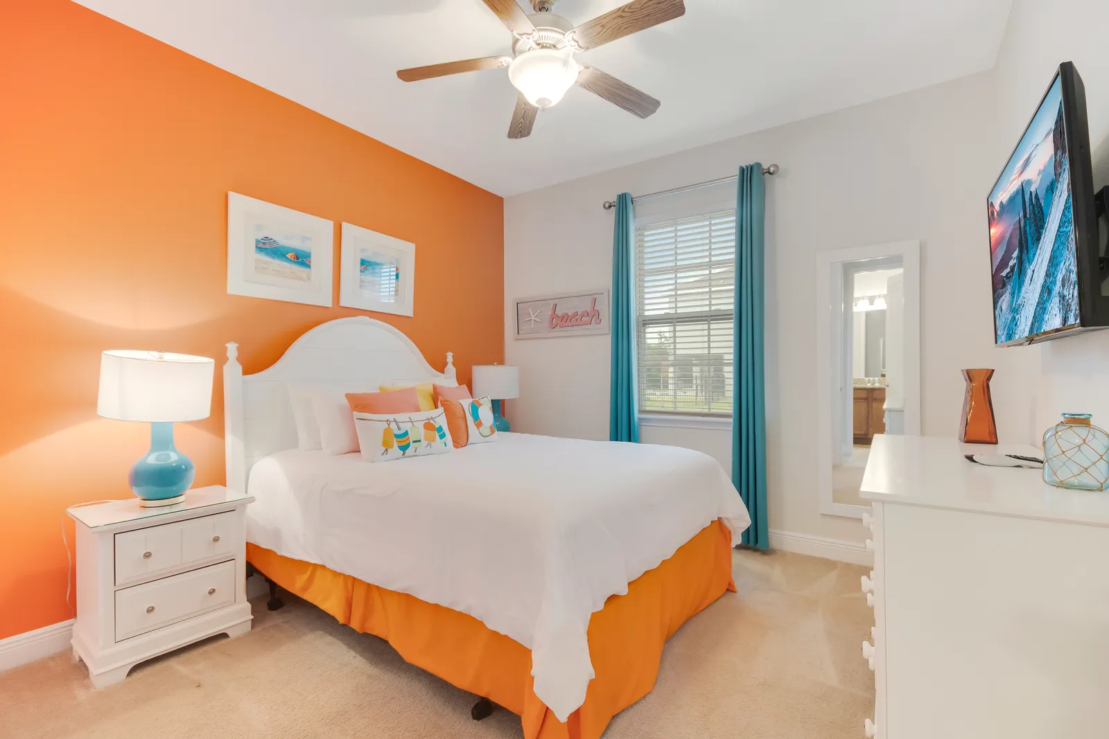 Colorful guest bedroom with queen bed